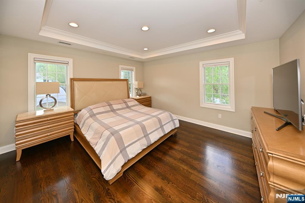 40 Plymouth Road Hillsdale, NJ 07642 - Photo 11 of 33 a bedroom with a bed and a flat screen tv