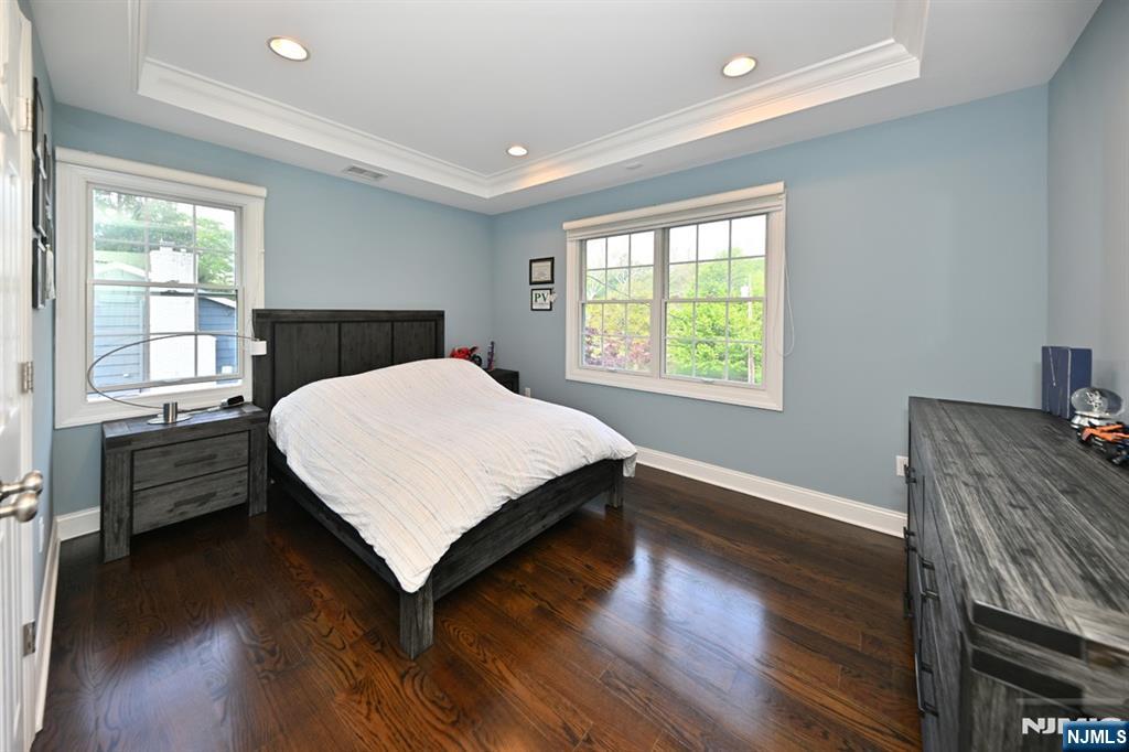40 Plymouth Road Hillsdale, NJ 07642 - Photo 14 of 33 a bed sitting in a bedroom next to a window