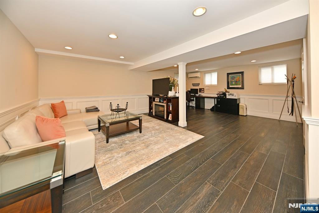 40 Plymouth Road Hillsdale, NJ 07642 - Photo 19 of 33 a living room with furniture and a wooden floor