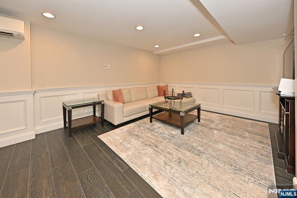40 Plymouth Road Hillsdale, NJ 07642 - Photo 20 of 33 a living room with furniture and a wooden floor