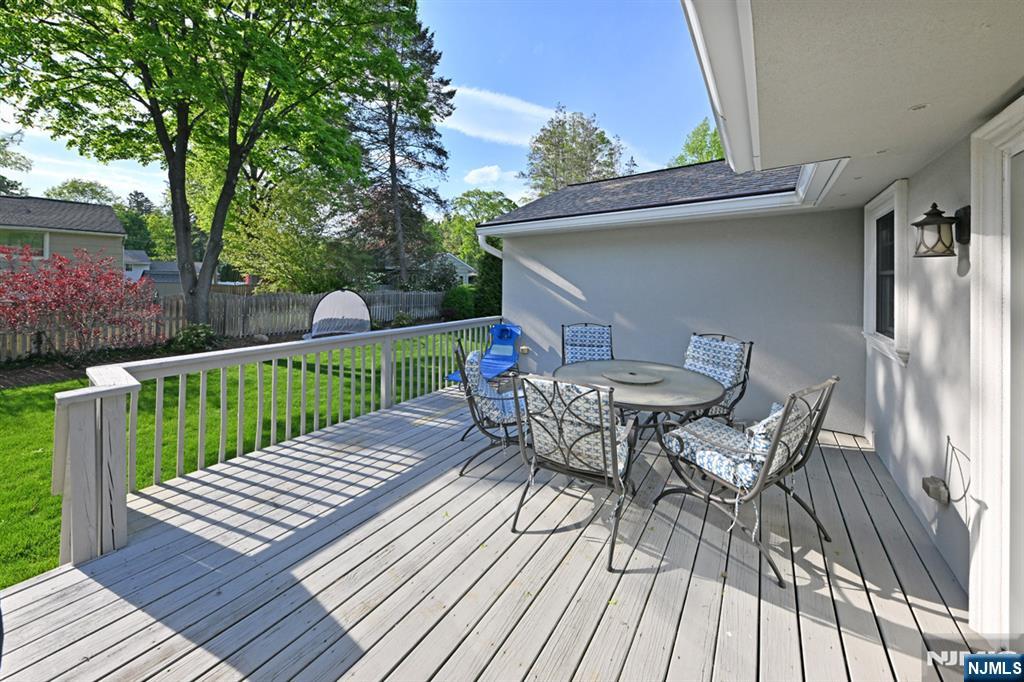 40 Plymouth Road Hillsdale, NJ 07642 - Photo 27 of 33 a view of a roof deck with table and chairs and wooden floor
