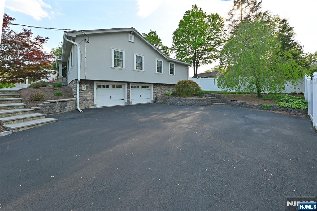 40 Plymouth Road Hillsdale, NJ 07642 - Photo 28 of 33 a house with trees in front of it