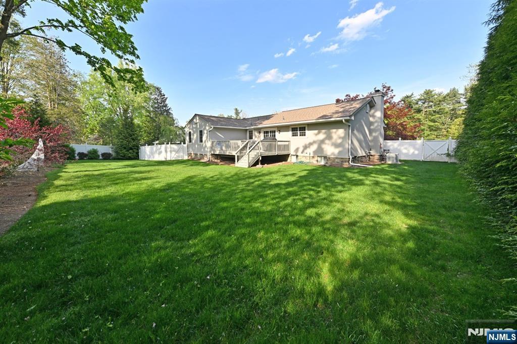 40 Plymouth Road Hillsdale, NJ 07642 - Photo 30 of 33 a front view of a house with a yard table and chairs