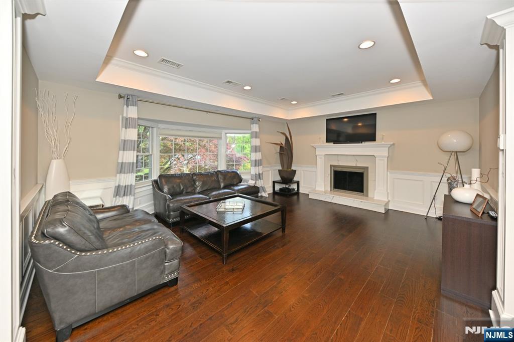 40 Plymouth Road Hillsdale, NJ 07642 - Photo 4 of 33 a living room with furniture and a fireplace