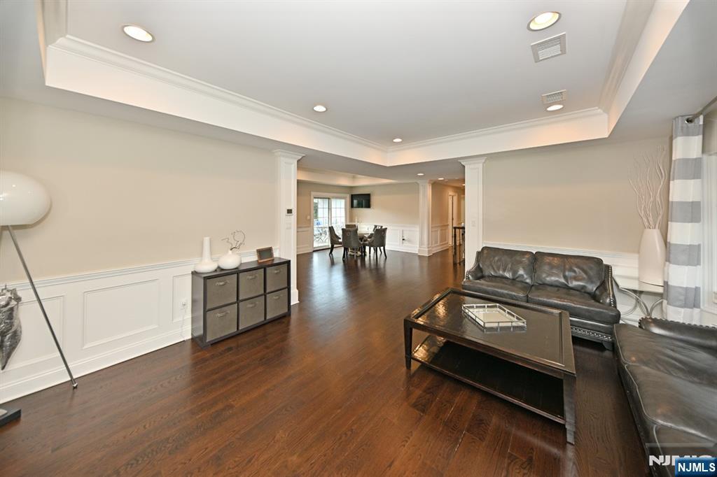 40 Plymouth Road Hillsdale, NJ 07642 - Photo 5 of 33 a living room with furniture and a wooden floor