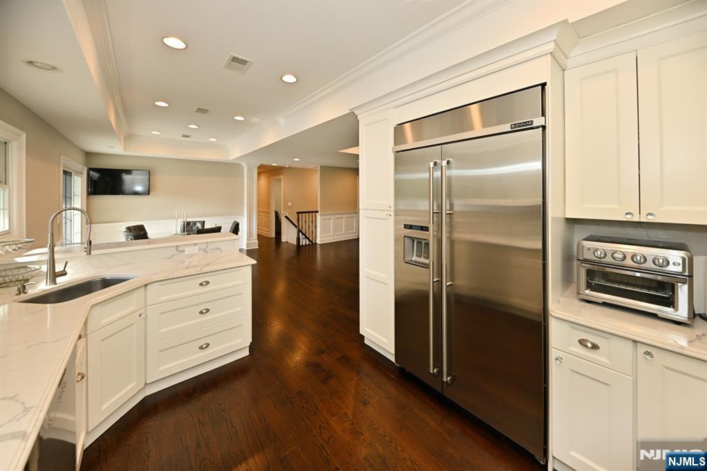 40 Plymouth Road Hillsdale, NJ 07642 - Photo 10 of 33 a kitchen with stainless steel appliances kitchen island granite countertop a refrigerator and a sink