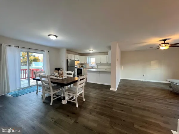 a bedroom with a bed and a ceiling fan