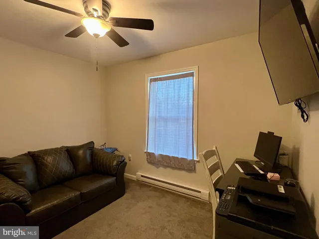 a bathroom with a double vanity sink toilet and mirror