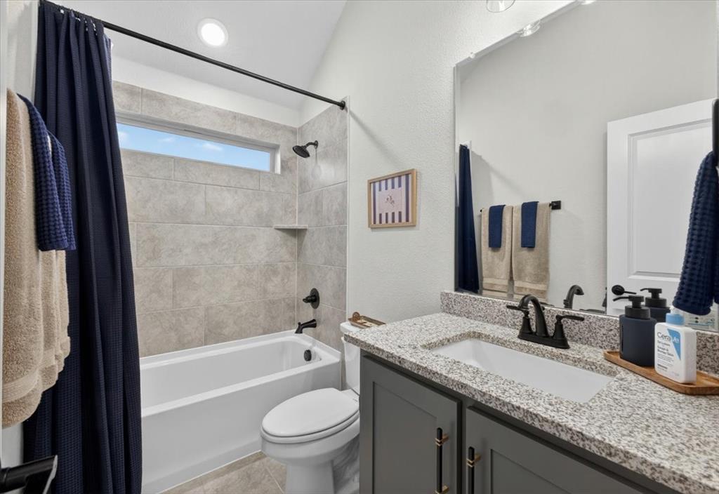 653 Godley Ranch Godley, TX 76044 - Photo 24 of 35 a bathroom with a granite countertop sink toilet and shower
