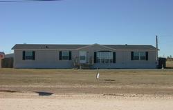 15600 Bell Street Amarillo, TX 79118 - Photo 1 of 1 a front view of a house with a yard