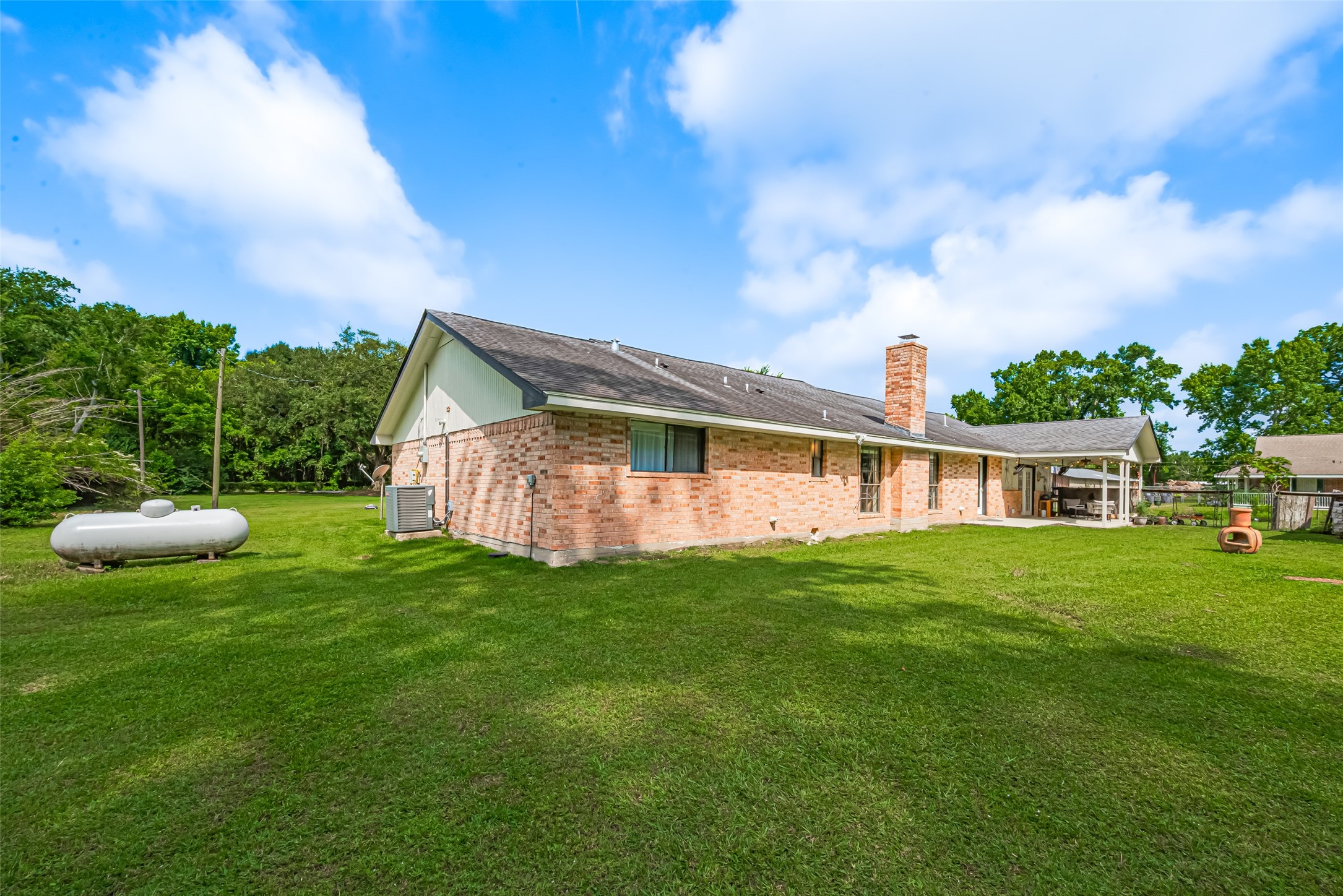 24314 Anderson Street Huffman, TX 77336 - Photo 47 of 48 a view of a house with a backyard