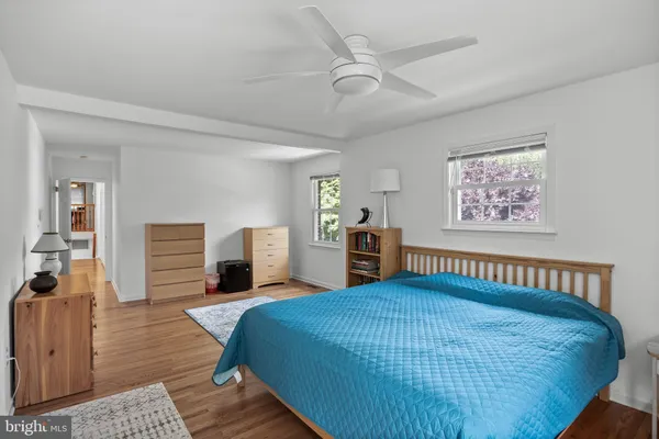 a bed room with a bed and a chandelier
