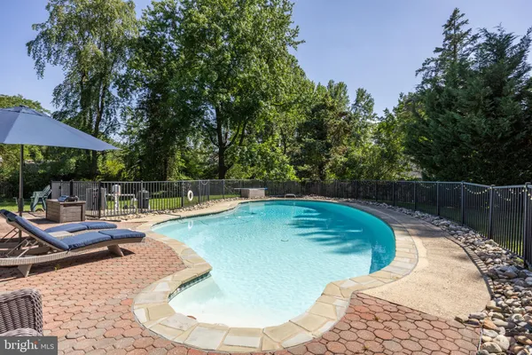 a view of a swimming pool with a patio