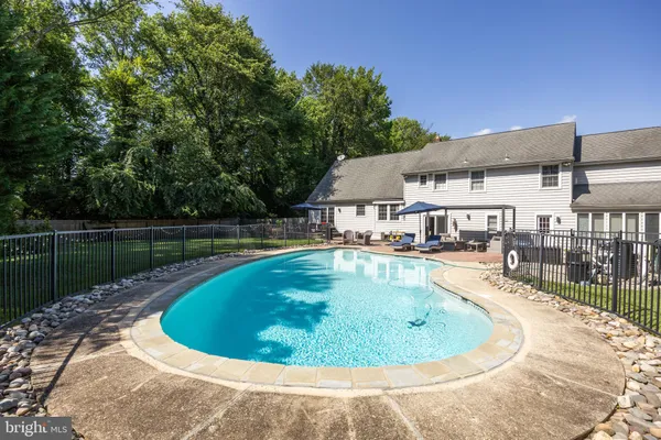 a view of a swimming pool with a patio