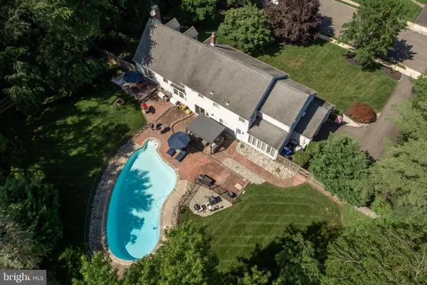 an aerial view of a house with outdoor space and street view