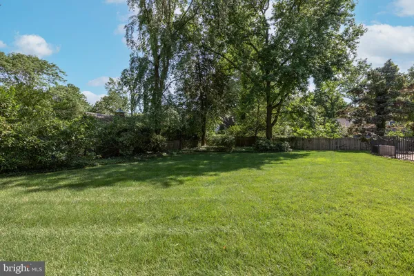 a view of outdoor space with deck and yard