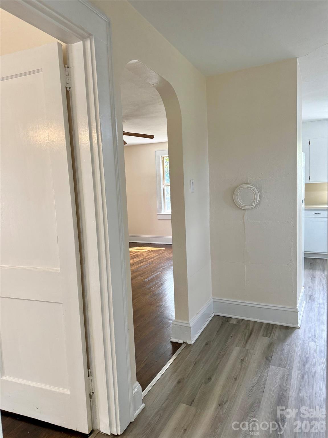 2025 28th Street Northeast Hickory, NC 28601 - Photo 13 of 17 an empty room with wooden floor and entrance
