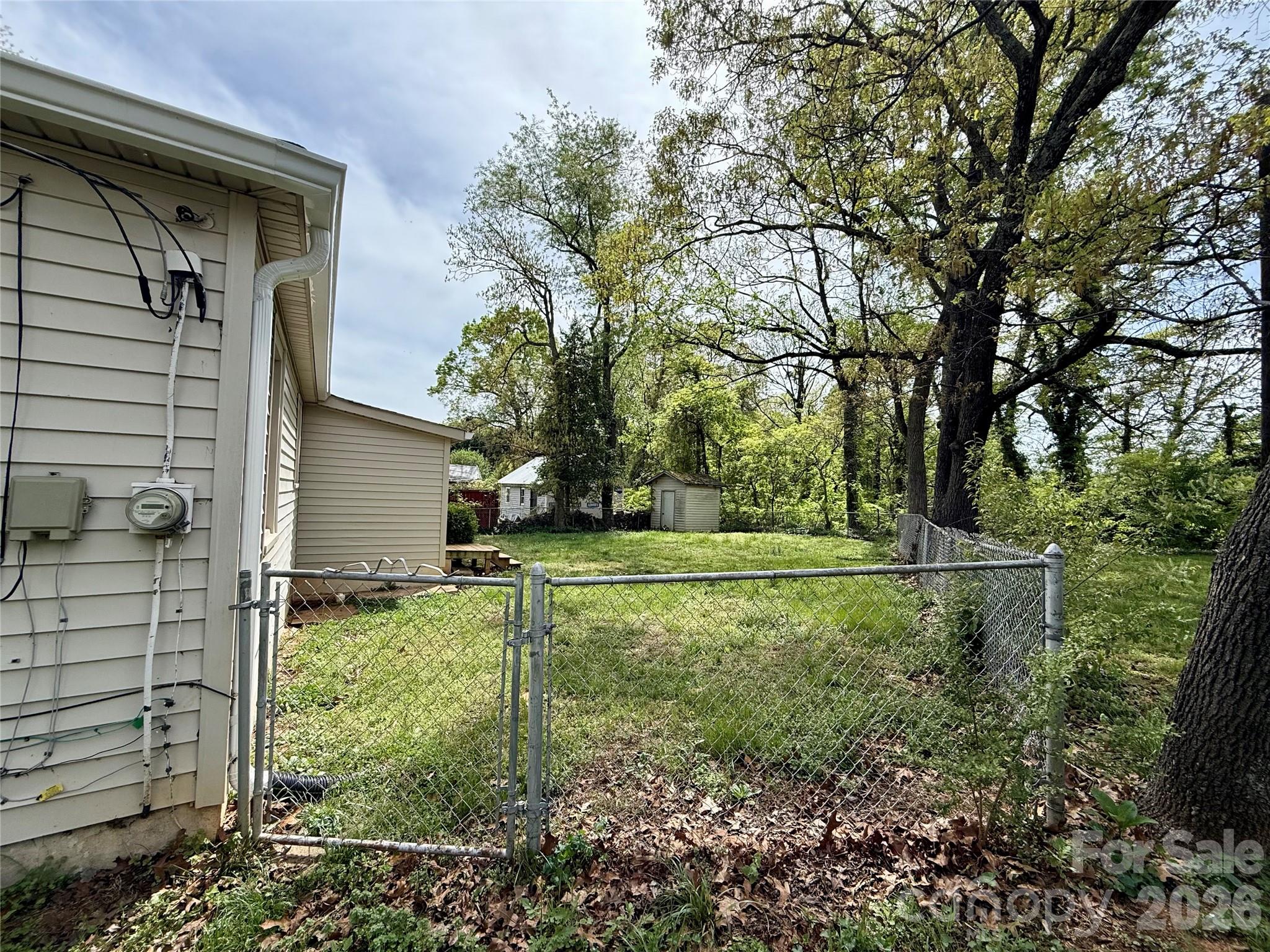 2025 28th Street Northeast Hickory, NC 28601 - Photo 15 of 17 a view of backyard of house and trees