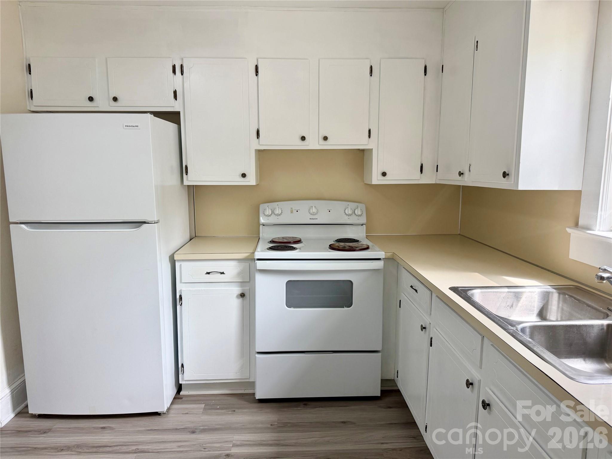 2025 28th Street Northeast Hickory, NC 28601 - Photo 2 of 17 a kitchen with a white cabinets and white appliances