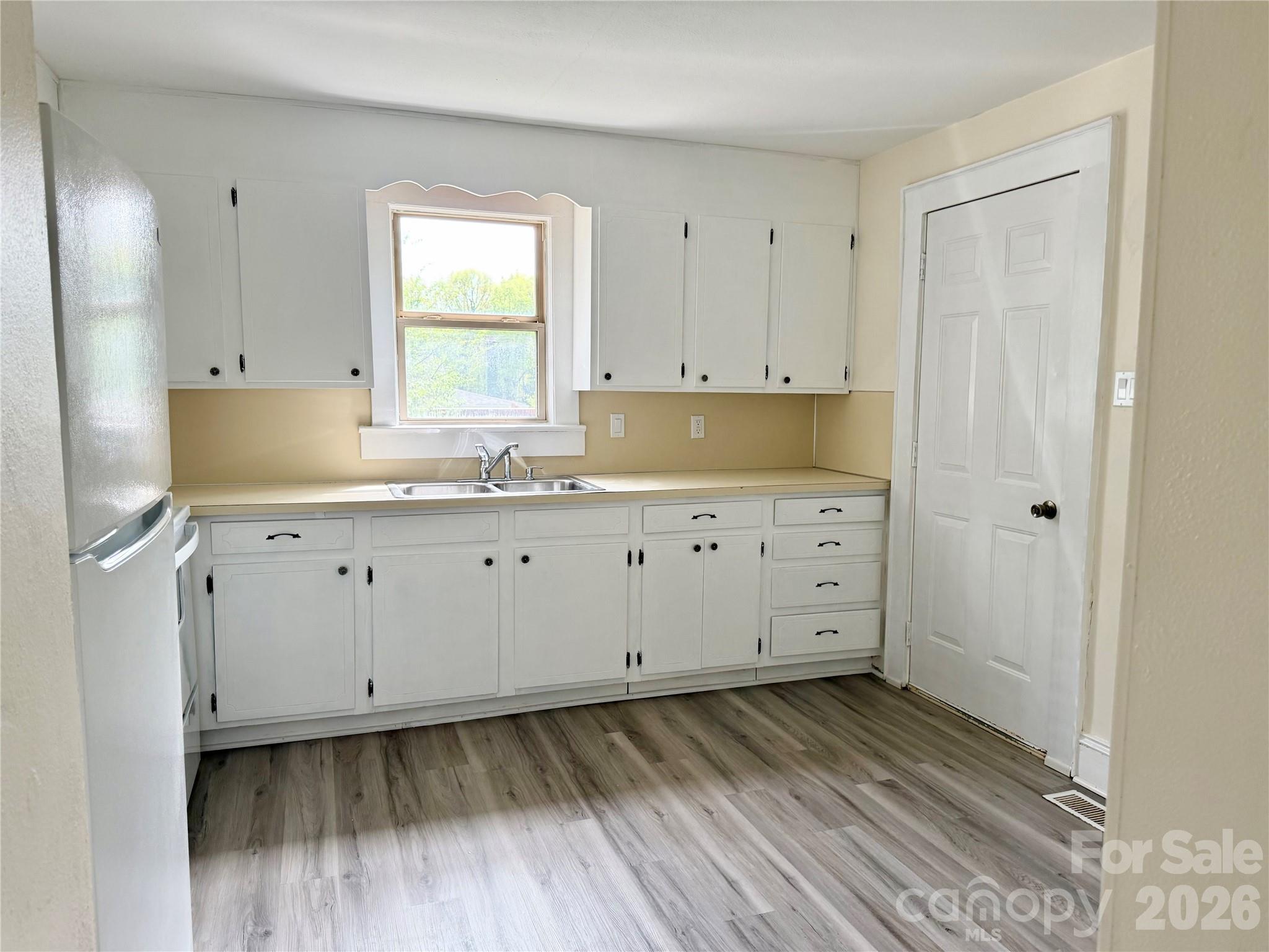 2025 28th Street Northeast Hickory, NC 28601 - Photo 3 of 17 a view of cabinets and wooden floor