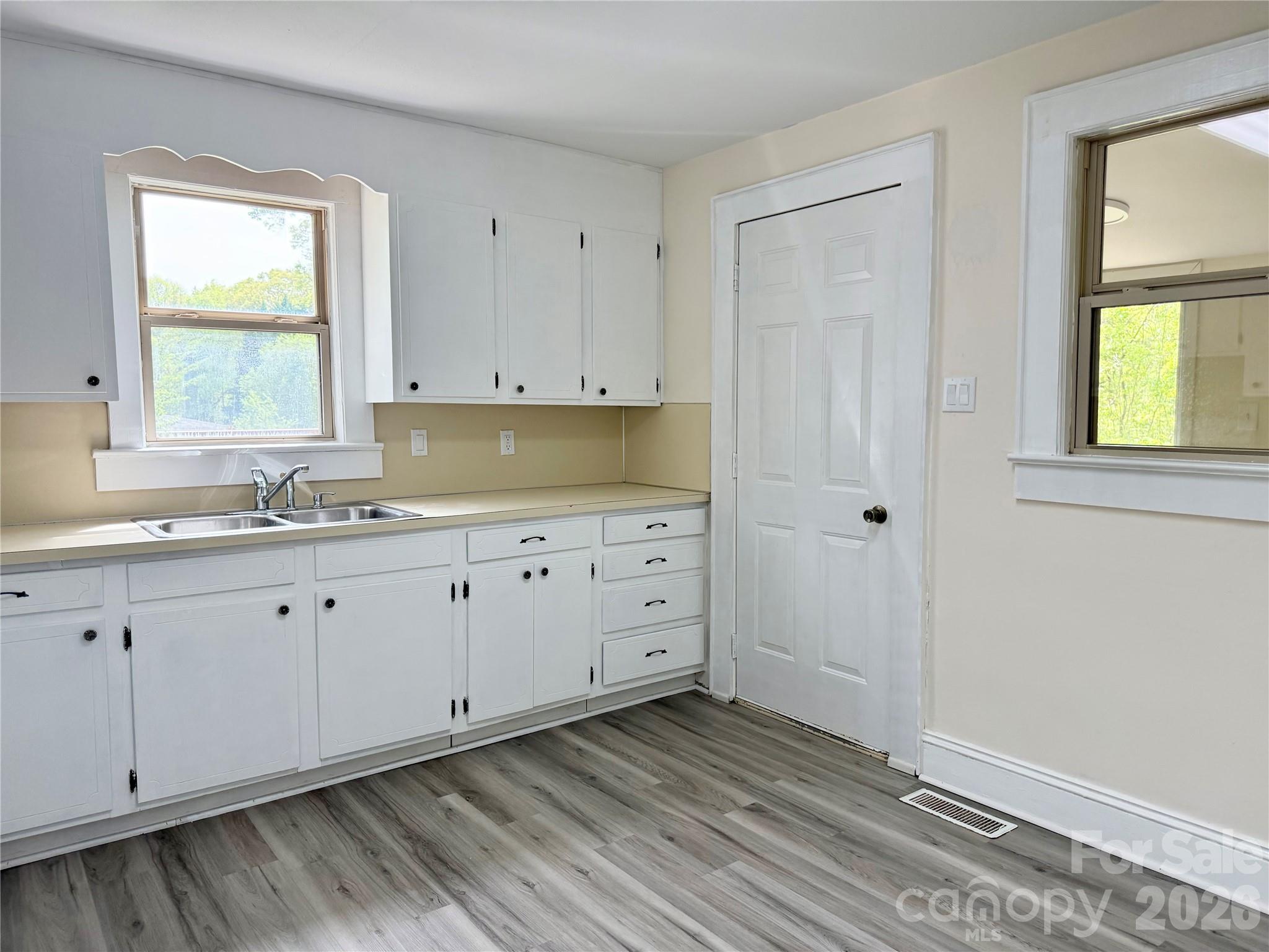 2025 28th Street Northeast Hickory, NC 28601 - Photo 4 of 17 a view of a kitchen with sink and window