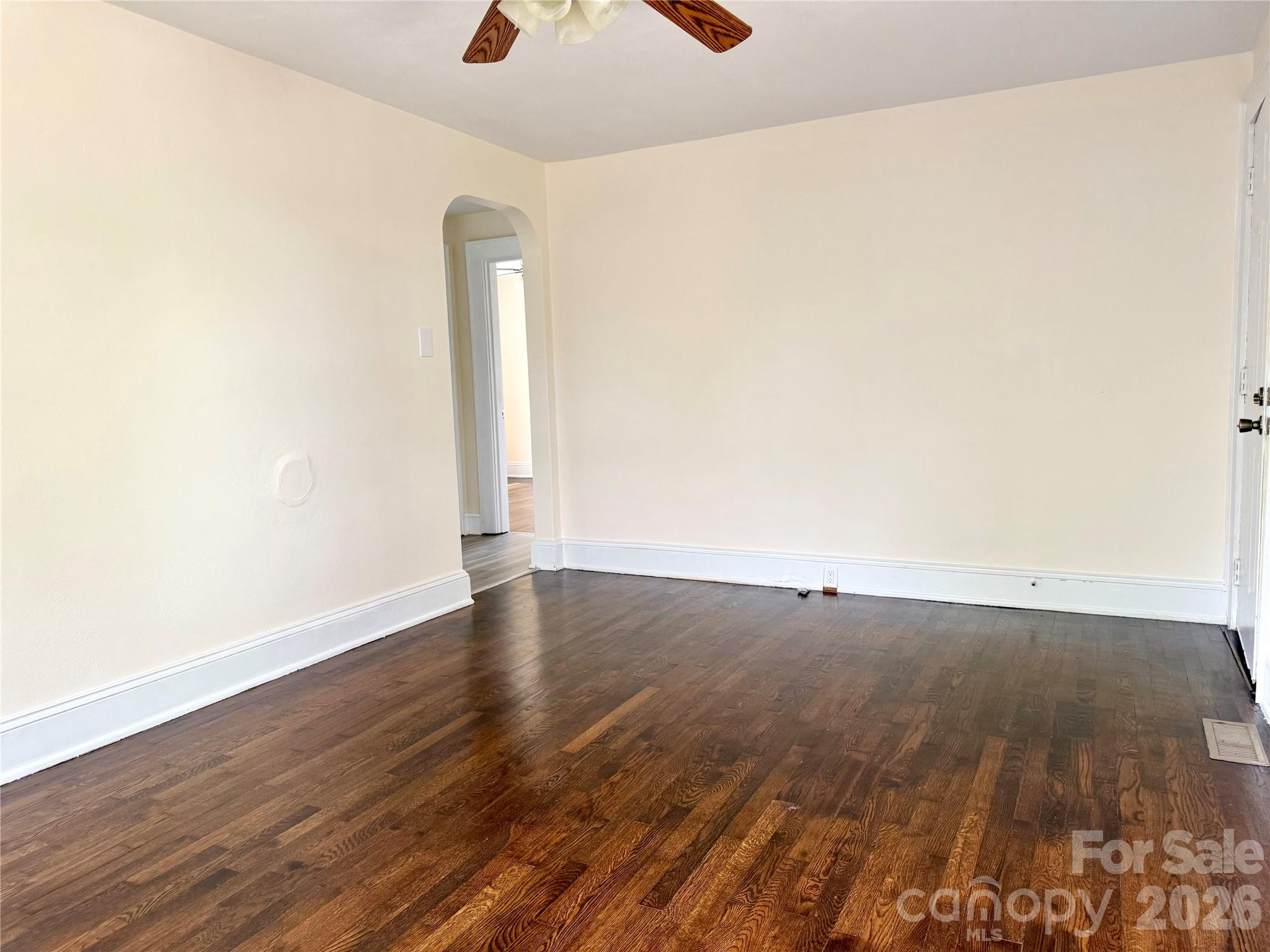 2025 28th Street Northeast Hickory, NC 28601 - Photo 10 of 17 an empty room with wooden floor and window