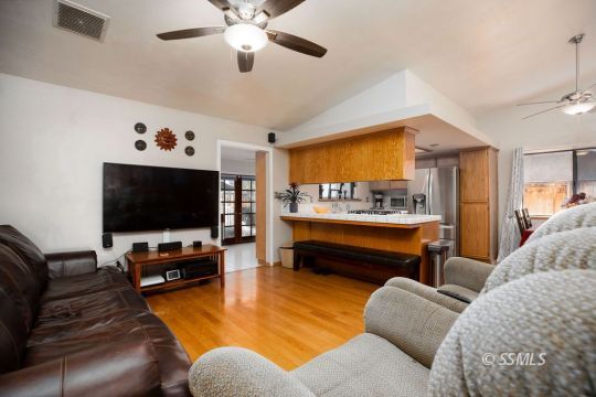 1004 Conejo Avenue Ridgecrest, CA 93555 - Photo 10 of 33 a living room with furniture and a flat screen tv