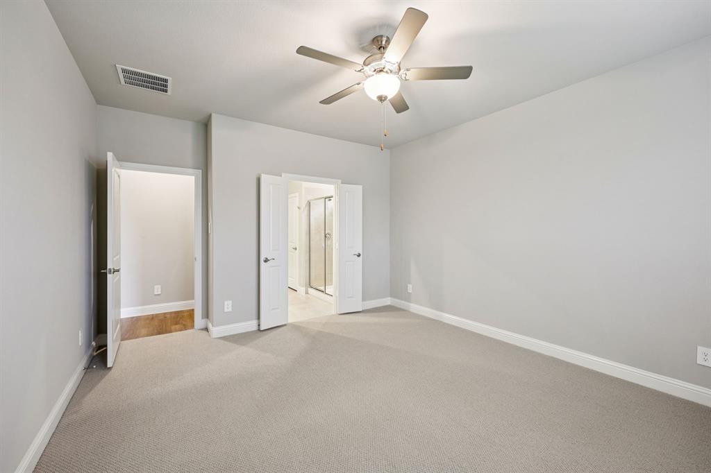 1721 Arches Road Anna, TX 75409 - Photo 23 of 39 an empty room with chandelier fan