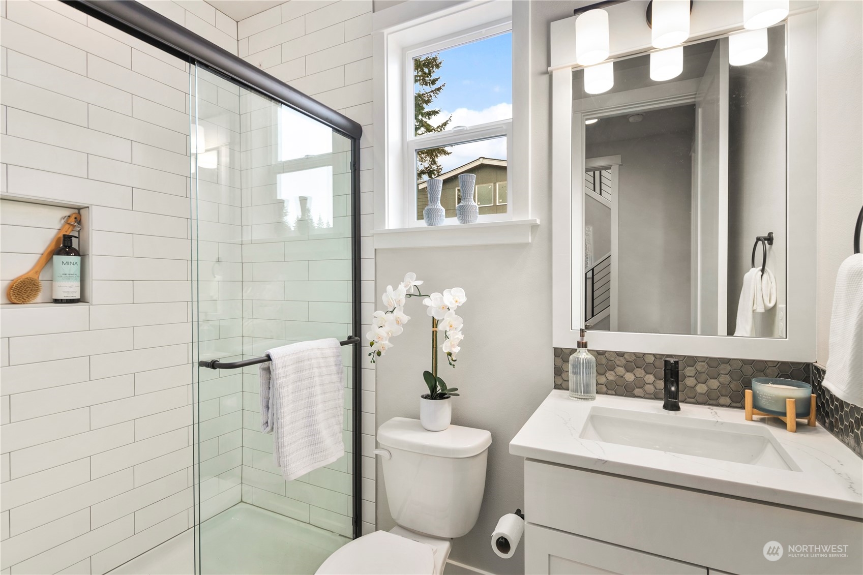 22530 Meridian Avenue South Bothell, WA 98021 - Photo 18 of 35 a bathroom with a sink a toilet and shower