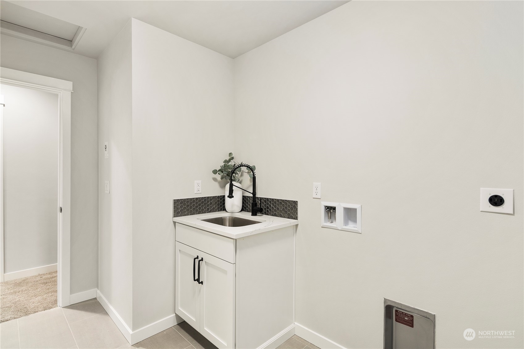 22530 Meridian Avenue South Bothell, WA 98021 - Photo 30 of 35 a kitchen with a sink and cabinets