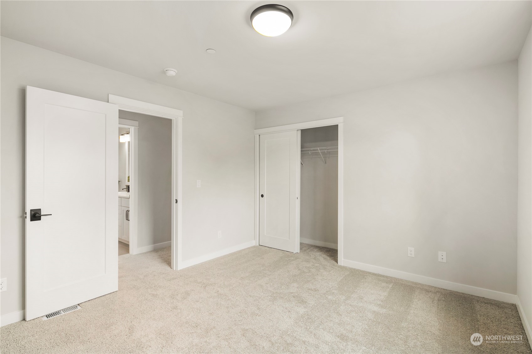 22530 Meridian Avenue South Bothell, WA 98021 - Photo 31 of 35 an empty room with closet and a bathroom