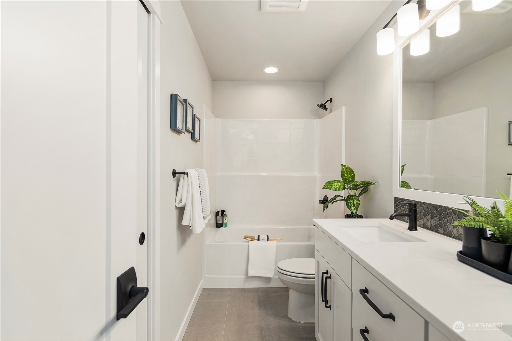 22530 Meridian Avenue South Bothell, WA 98021 - Photo 32 of 35 a bathroom with a sink a toilet and shower