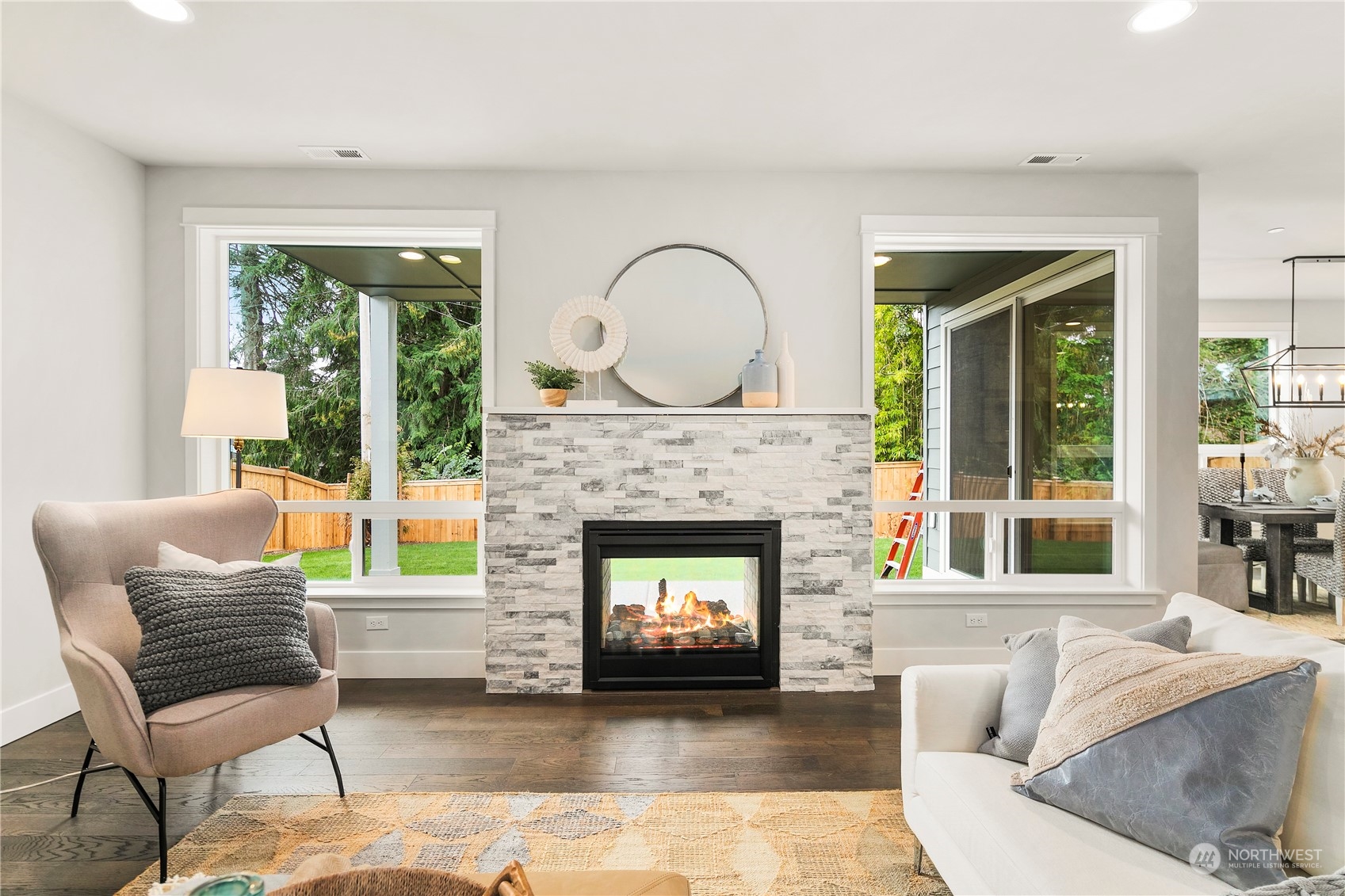 22530 Meridian Avenue South Bothell, WA 98021 - Photo 5 of 35 a living room with furniture and a fireplace
