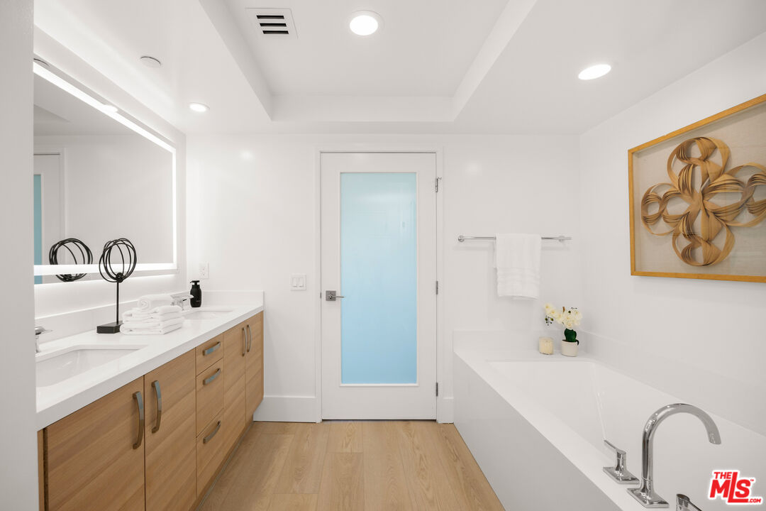 13650 Marina Pointe Drive, Unit 908 Marina del Rey, CA 90292 - Photo 12 of 33 a spacious bathroom with a double vanity sink and a bathtub