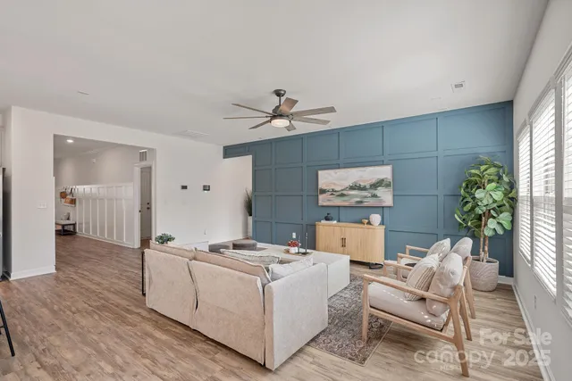 a living room with furniture and a table