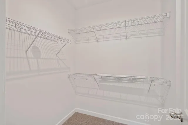 a view of a room with racks on the wall
