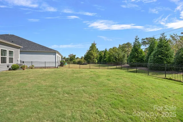 a backyard of a house with lots of green space