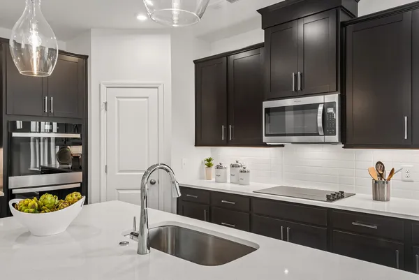 a kitchen with a sink and cabinets