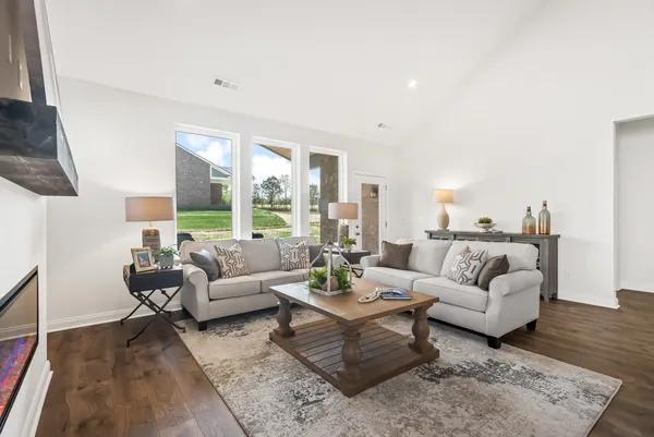 a living room with furniture and a fireplace