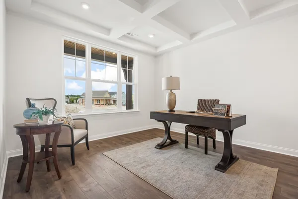 a workspace with furniture and a window