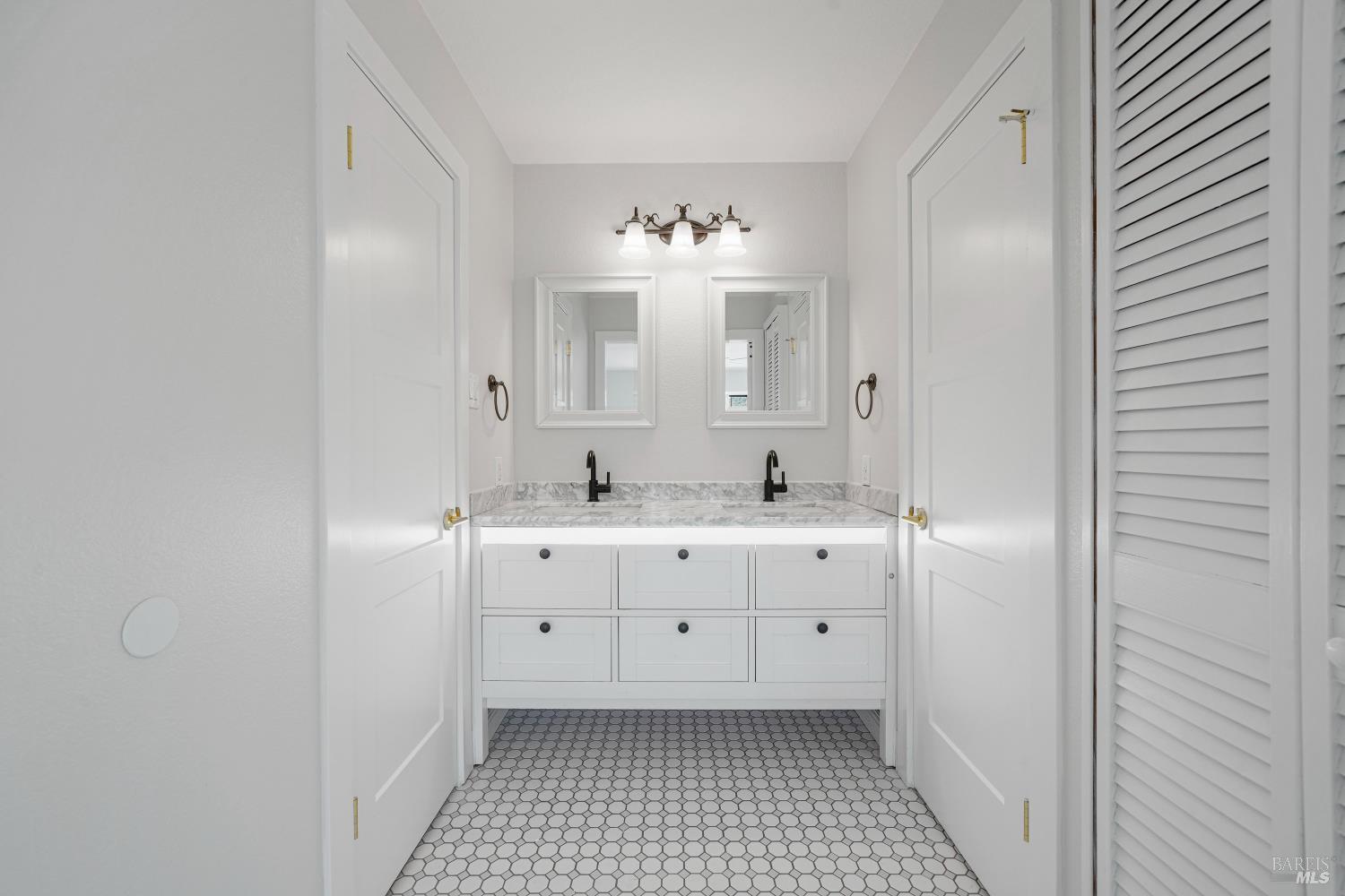 2129 Rockville Road Fairfield, CA 94534 - Photo 22 of 59 a spacious bathroom with a double vanity sink a mirror and a