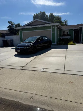 a view of a car parked in the parking lot