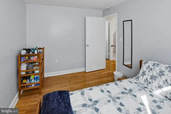 a bedroom with a bed and a book shelf