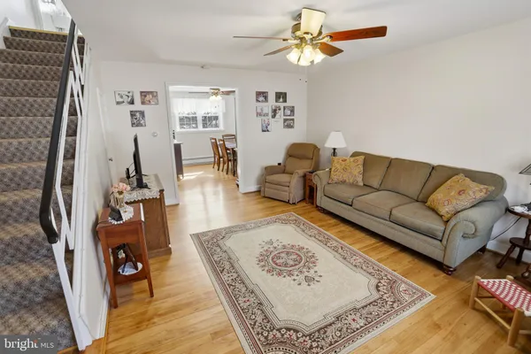 a living room with furniture and a rug
