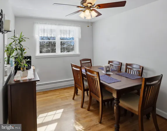 a view of a dining room with furniture and window