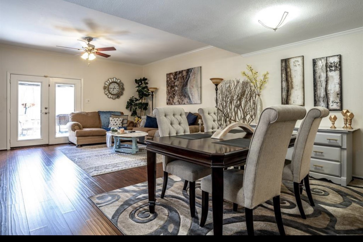 2228 South Piney Point Road, Unit 101 Houston, TX 77063 - Photo 2 of 8 a living room with furniture and wooden floor
