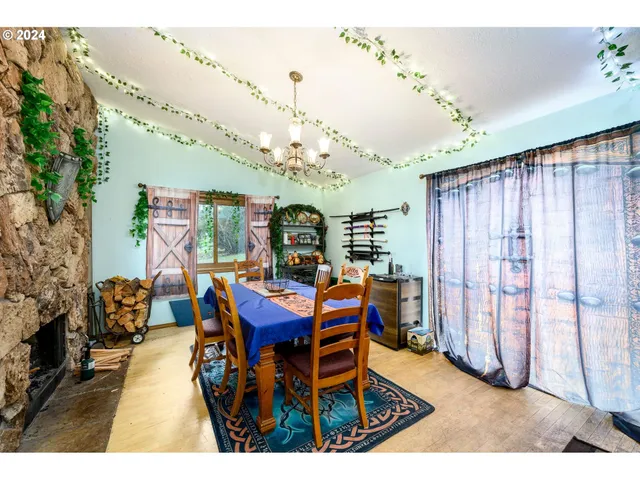 a view of a dining room with furniture and chandelier