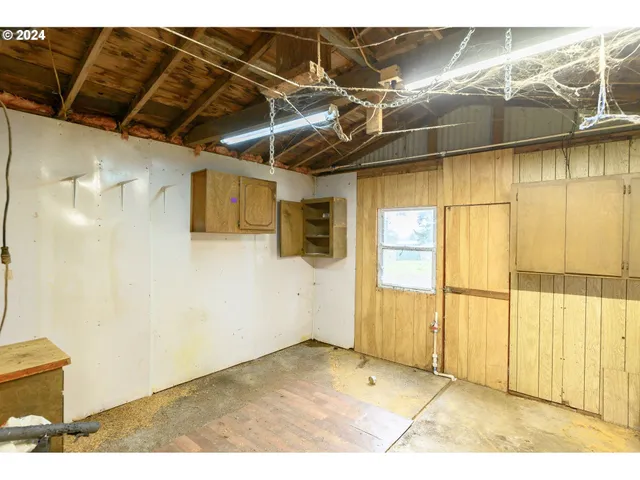 a view of a garage with wooden floor