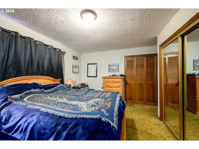 a bedroom with a bed and a closet