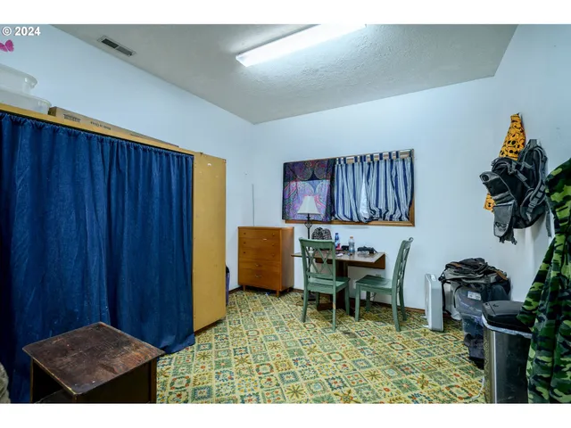 a workspace room with furniture